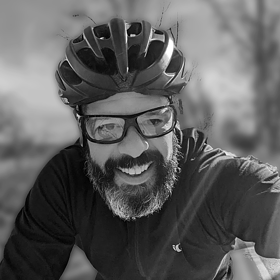 Smiling bearded man in bike helmet